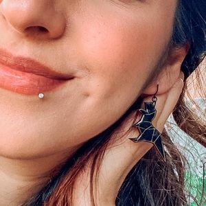 Origami t-rex earrings in black.